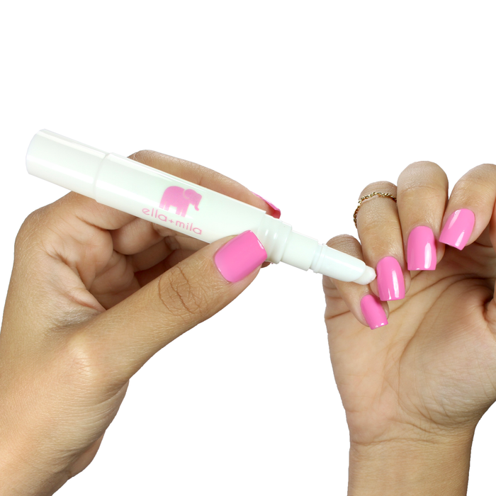 Using Polish Corrector pen to clean up a hot pink manicure