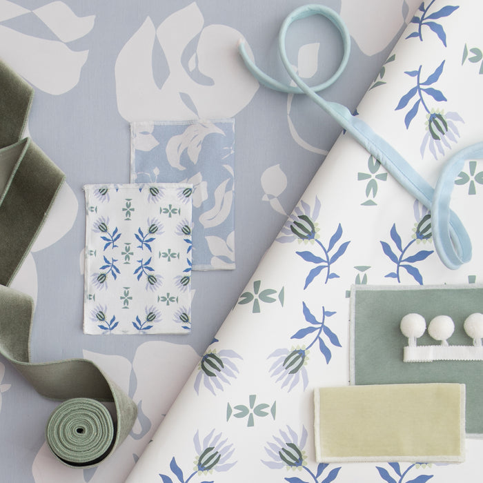 Powder made-to-order fabric with soft blue floral and leaf patterns, crafted in the USA with quick turnaround times