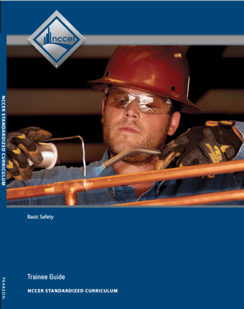 NCCER Basic Safety trainee guide cover showing a worker in safety gear soldering copper pipes against blue background