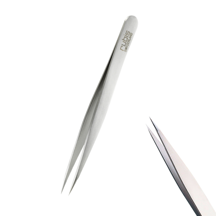 T100 Rubis Sharp Point Brow Tweezer | A pair of Rubis silver metal tweezers with a sharp point and with the brand name 'Rubis' printed on the handle, shown against a solid white background with a second pair of tweezers partially visible in the lower right corner.