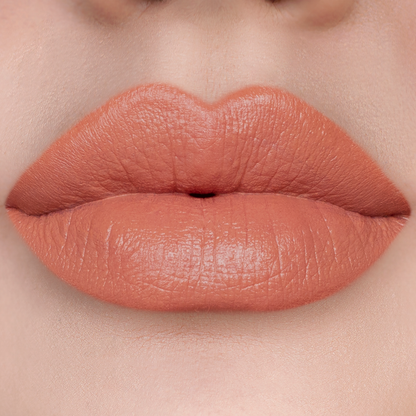 Set Plans warm peach nude lipstick on lips, light skin tone