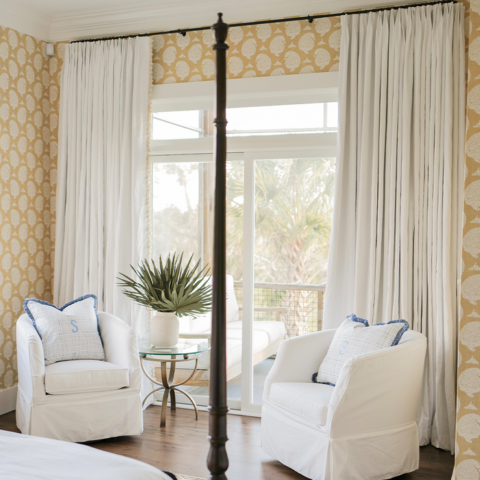Snow white curtains framing a bright room, made to order and manufactured in the USA with short lead times