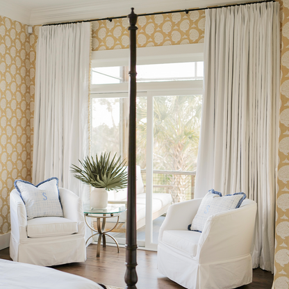 Snow white curtains framing a bright room, made to order and manufactured in the USA with short lead times