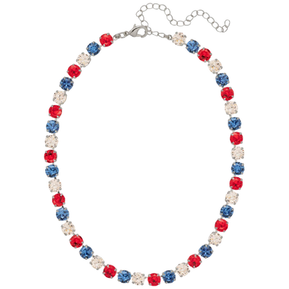 A patriotic beaded necklace featuring alternating red, blue, and clear rhinestone beads on a silver-tone chain with an extender clasp, shown against a plain white background.