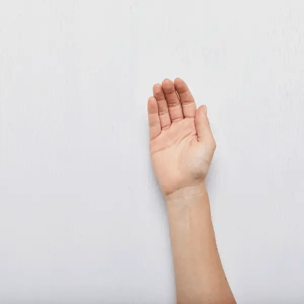 hand using Super Greens Detoxifying Facial Scrub
