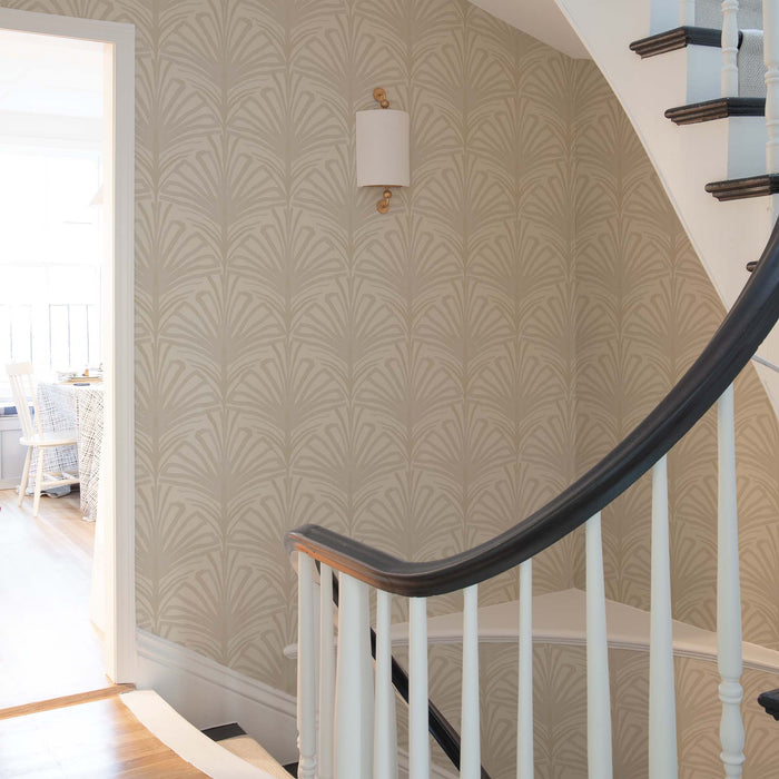 Curved staircase with Suzy Sand wallpaper featuring subtle palm pattern, made-to-order with short lead times, manufactured in the USA