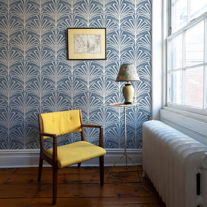 Cozy corner with Suzy Steel wallpaper in soft gray botanical pattern, paired with yellow chair, made-to-order, USA-made.