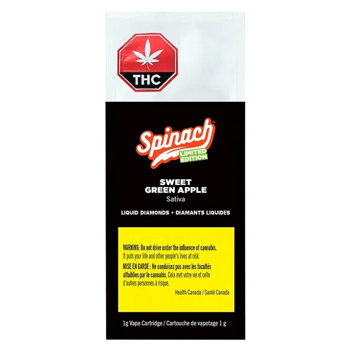 Front-facing pack shot showing the Spinach Sweet Green Apple Liquid Diamonds Vape Cartridge packaging with black background, red THC symbol and yellow warning panel.