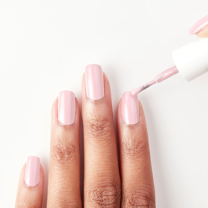 Applying Team Sweets light baby pink nail polish