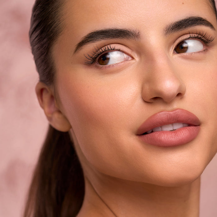 Close-up of a model's eye and brow displaying a natural lash look from The Sweetie Daily Lash Routine Set