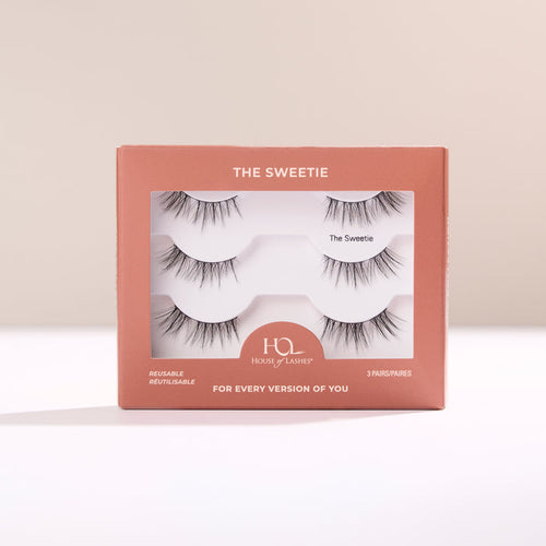 The Sweetie Half Lash box in peach tones with lashes visible through the window