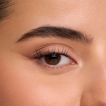 Close-up of an eye with long natural looking lashes from The Sweetie Half Lash product.