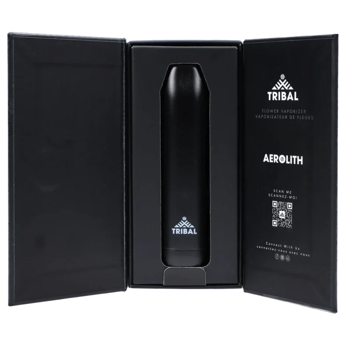 Center view of the black Tribal Aerolith Dry Herb Vaporizer nestled upright in its open black presentation box with printed logo and QR code on the right panel.