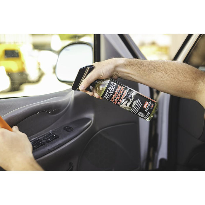 P&S Xpress 16oz bottle spraying on interior of car.